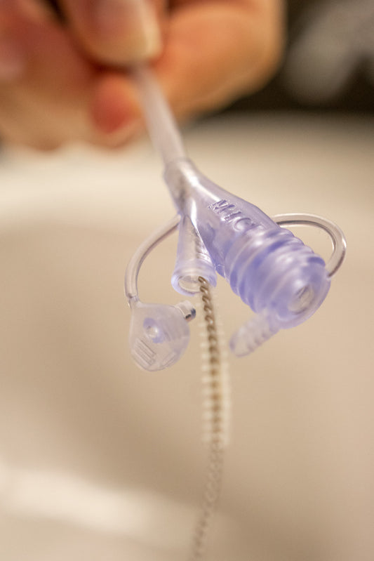 Cleaning brush for enteral feeding tubes